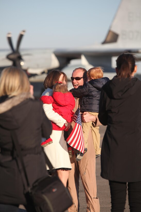Maj. Graham Mueller hugs his family at Marine Corps Air Station Cherry Point, N.C., Jan. 21, 2016. The Marines deployed to Africa and Spain, where they assisted the Personnel Recovery Task Force by working hand-in-hand with other United States military branches. The mission focused on the skills and abilities of service members to successfully reintegrate and recover isolated personnel. On Jan. 13, VMGR-252 welcomed home another detachment, who remained in Moron, Spain. In total the detachment’s Marines moved over 2,900 passengers, 778,000 pounds of cargo and delivered 845,000 pounds of fuel to receiver aircraft. (U.S. Marine Corps photo by Cpl. Unique Roberts/ Released)