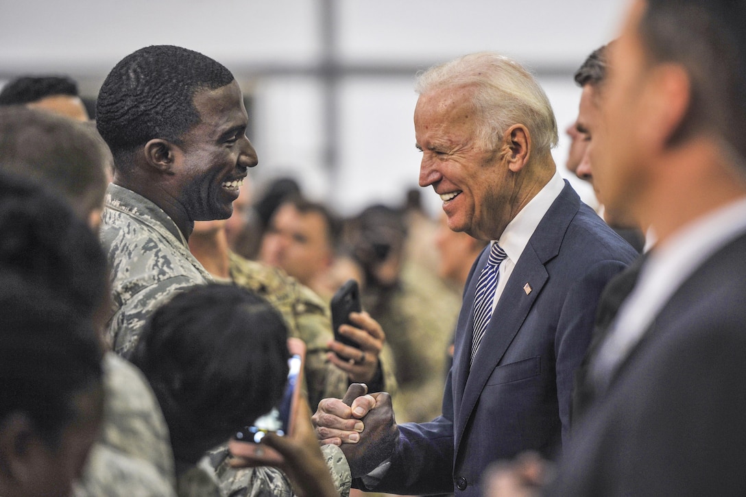 Vice President Joe Biden shakes hands with Air Force Staff Sgt. Demetric at an undisclosed location in Southwest Asia, March 7, 2016. Biden and his wife, Dr. Jill Biden, greeted troops and posed for photos with U.S. and coalition members before departing the base for the next part of their tour of the Mideast. Air Force photo by Staff Sgt. Kentavist P. Brackin
