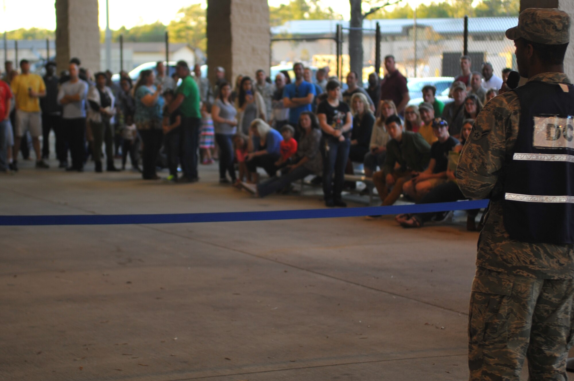 Airman 1st Class Joshua N. White, logistics planner with the 1st Special Operations Logistics Readiness Squadron, informs families that their Airmen are almost home during Operation Homecoming at the deployment control center, Hurlburt Field, Fla., March 6, 2016. Operation Homecoming welcomed home Air Commandos from their overseas deployment. (U.S. Air Force photo by Airman 1st Class Joseph Pick)
