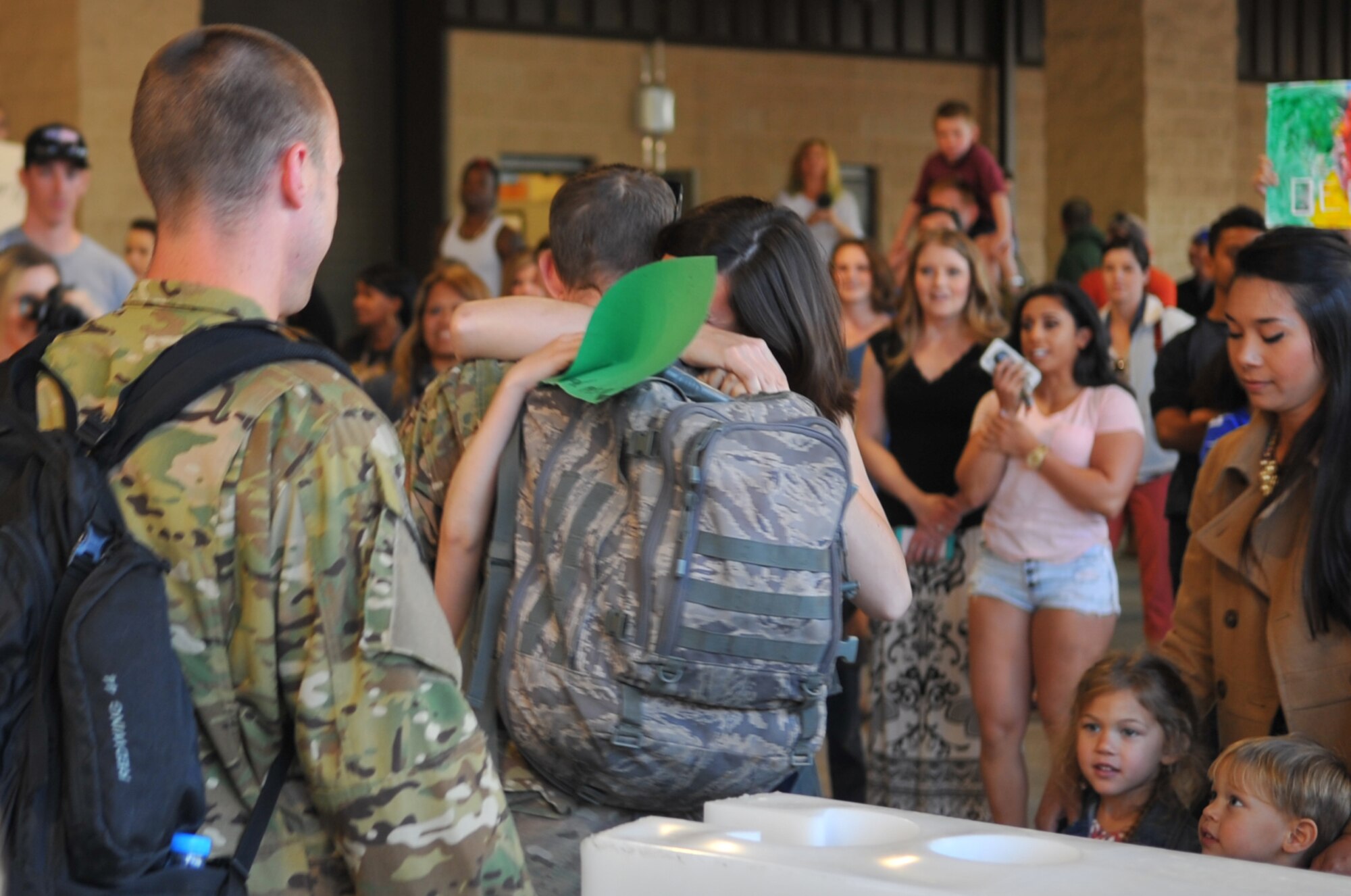 Families greet their returning Air Commandos during Operation Homecoming at the deployment control center, Hurlburt Field, Fla., March 6, 2016. Operation Homecoming welcomed home Air Commandos from their overseas deployment. (U.S. Air Force photo by Airman 1st Class Joseph Pick)