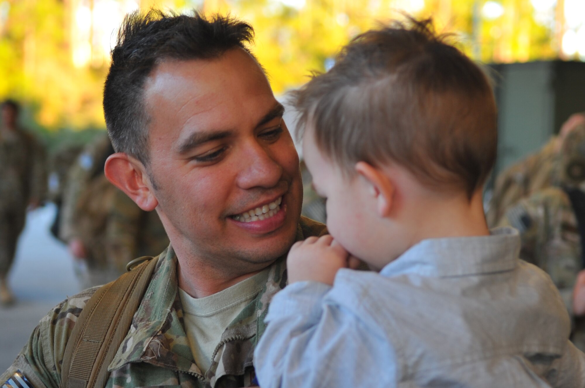 Tech. Sgt. Joshua K. Paakaula, weapons expediter with the 1st Special Operations Aircraft Maintenance Squadron, greets his son during Operation Homecoming at Hurlburt Field, Fla., March 6, 2016. Operation Homecoming welcomed home Air Commandos from their overseas deployment. (U.S. Air Force photo by Airman 1st Class Joseph Pick/Released)