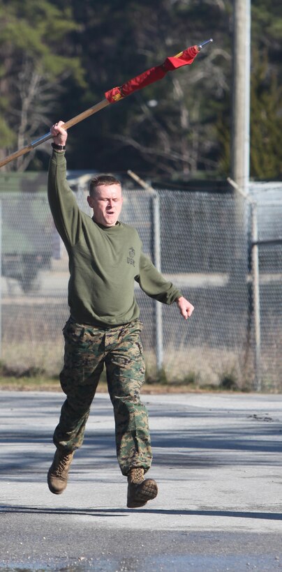 Captain Ronnie Creech runs to the finish line during Marine Wing Communication Squadron 28’s semi-annual Spartan Cup field meet at Marine Corps Air Station Cherry Point, N.C., Jan. 29. The Marines competed in various activities, including tug-of-war and the running of the ranks, in which the three companies battled head-to-head to win the squadron’s Spartan Cup. The field meet is held to further strengthen esprit de corps and unit cohesion within the squadron, and to foster a sense of unit pride while improving Marines’ overall readiness. Creech is the company commander for Company A, MWCS-28. (U.S. Marine Corps photo by Cpl. Unique Roberts/ Released)