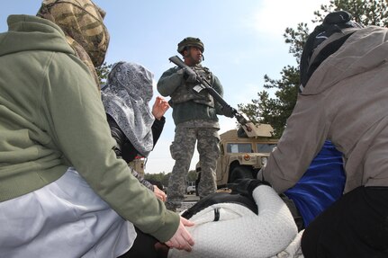 U.S. Army Spc. Daniel Montenegro of the 957th Quartermaster Company (QM Co.) maintains security at an entry control point after simulated insurgent activities on Joint Base McGuire-Dix-Lakehurst, N.J., March 6, 2016. Soldiers of the 957th QM Company are participating in Combat Support Training Exercise 78-16-01 to improve unit readiness.