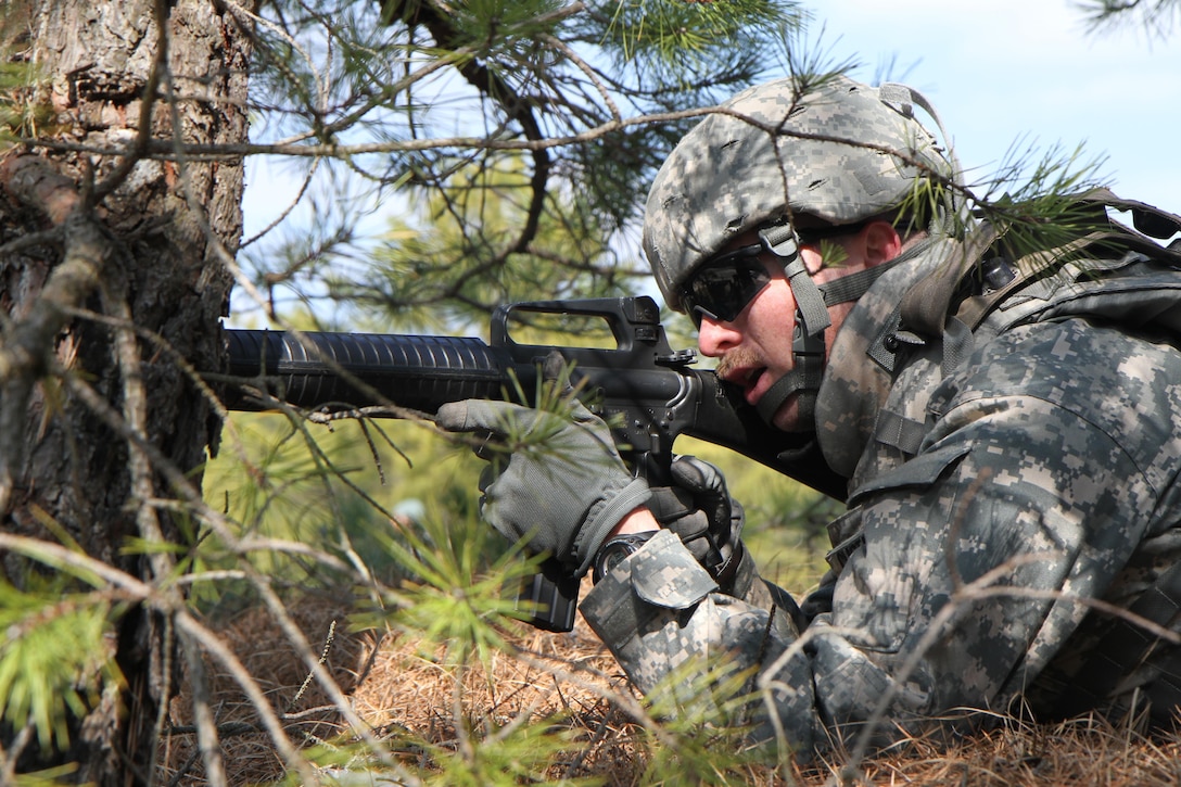 U.S. Army Spc. John Curtin of the 957th Quartermaster Company (QM Co.) engages notional insurgents during a simulated attack on Joint Base McGuire-Dix-Lakehurst, N.J., March 6, 2016. Soldiers of the 957th QM Company are participating in Combat Support Training Exercise 78-16-01 to improve unit readiness.