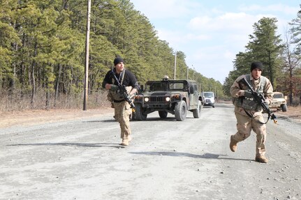 U.S. Army Soldiers assigned to Delta Company, 3rd Battalion, 187th Infantry Division, 101st Airborne Division (3-187) engage Soldiers of the 196th Transportation Company during a simulated convoy attack on Joint Base McGuire-Dix-Lakehurst, N.J., March 6, 2016. Soldiers of the 3-187 are tasked as a notional opposing force to provide training units with improved readiness during Combat Support Training Exercise 78-16-01.