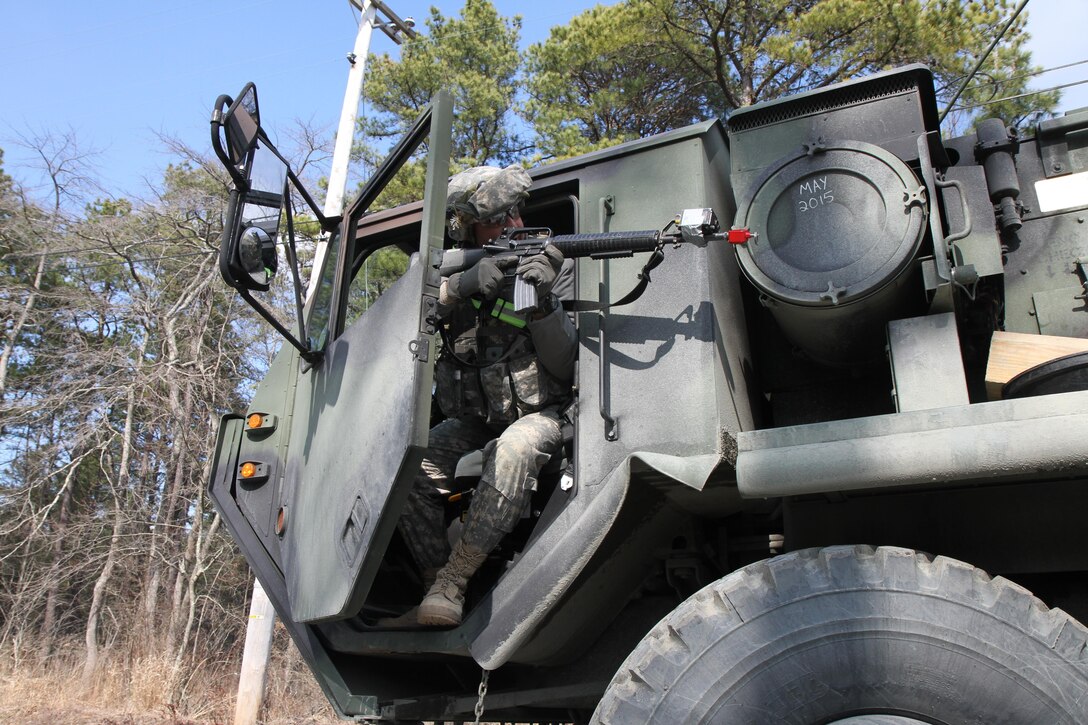 A U.S. Army Soldier assigned to the 196th Transportation Company (TC Co.) engages notional insurgents with his M16A2 rifle during a simulated convoy attack on Joint Base McGuire-Dix-Lakehurst, N.J., March 6, 2016. Soldiers of the 196th TC Company are participating in Combat Support Training Exercise 78-16-01 to improve unit readiness.