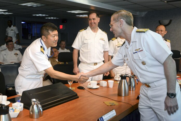 MANILA, Philippines (Mar. 5, 2016) - Vice Adm. Joseph Aucoin, right, the commander of U.S. 7th Fleet, shakes hands with Capt. Tsugunori Niizuma of the Japan Maritime Self-Defense Force during trilateral talks between the U.S., Philippines and Japan held aboard USS Blue Ridge (LCC 19), in Manila, Philippines. The trilateral talks are being held to enhance cooperation and strengthen relationships to best provide security and stability in the Indo-Asia Pacific. 