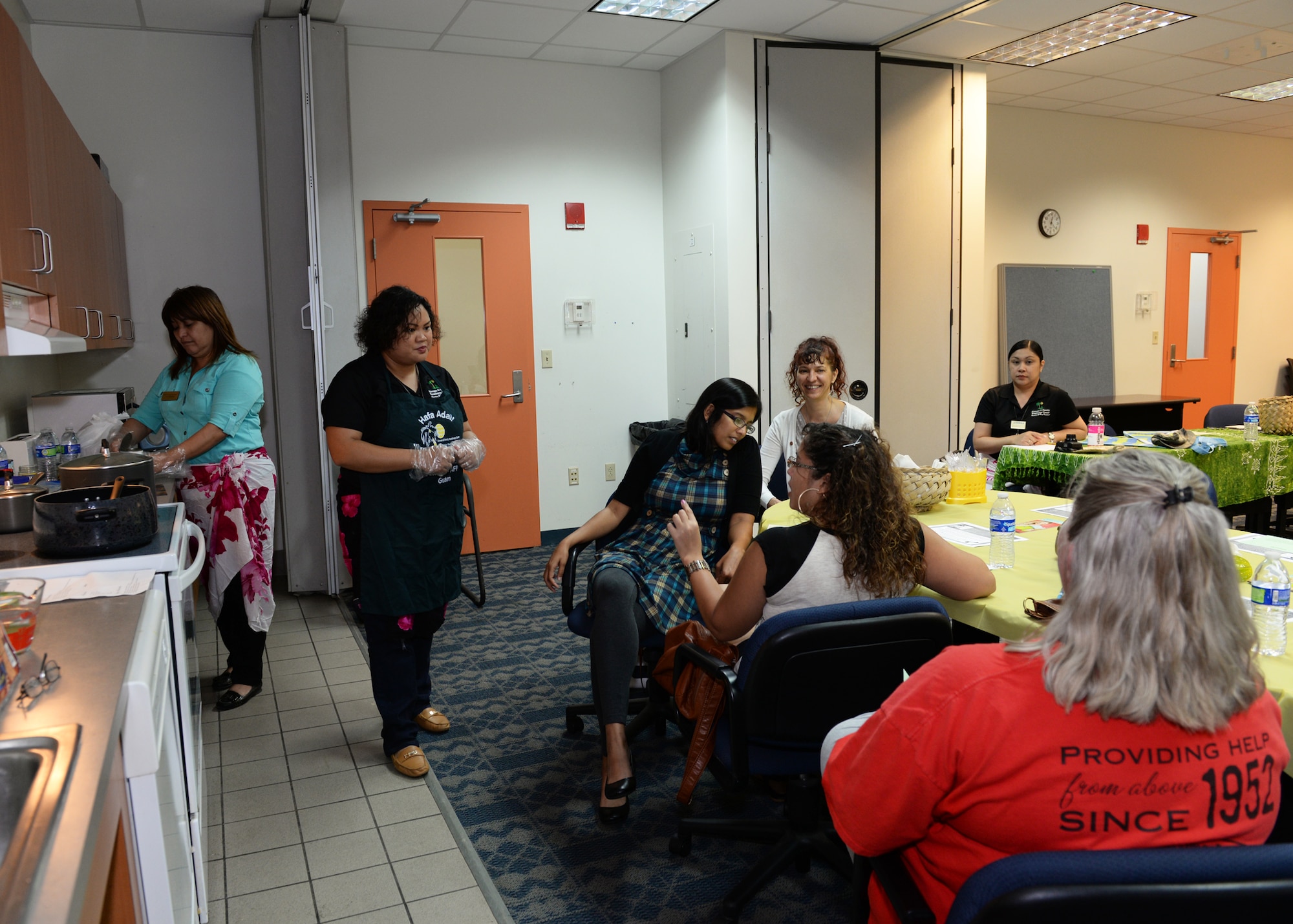 Hope Cortez, 36th Force Support Squadron Airman and Family Readiness Center work life consultant, answers questions during a Chamorro Heritage month cooking class March 4, 2016, at Andersen Air Force Base, Guam. Throughout the month of March, the A&FRC will be hosting a variety of classes and activities surrounding local culture, customs and traditions. (U.S. Air Force photo/Senior Airman Cierra Presentado)