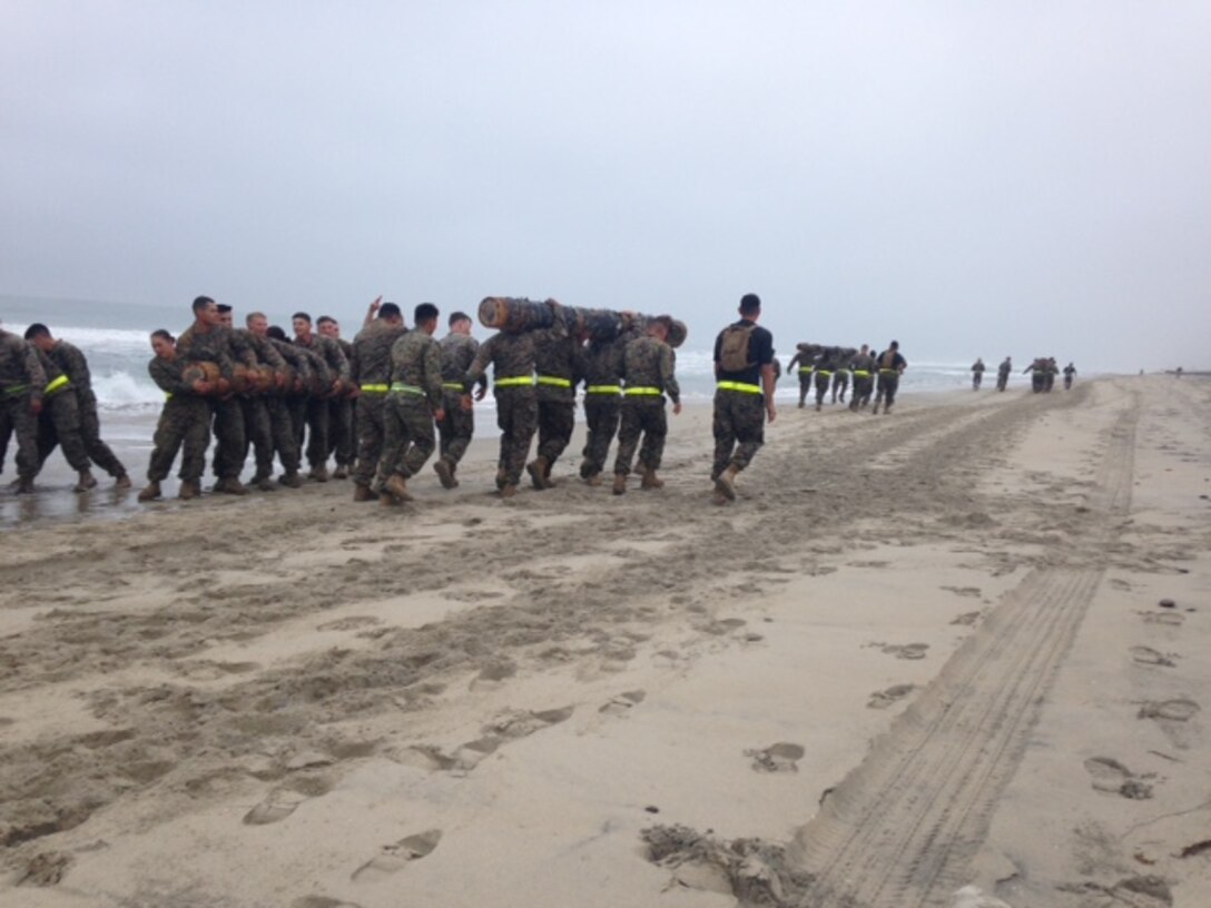 Aboard Camp Pendleton California Corporals Course 349-16 conducts the Directors 4 Mile Log Run along the California Coast.