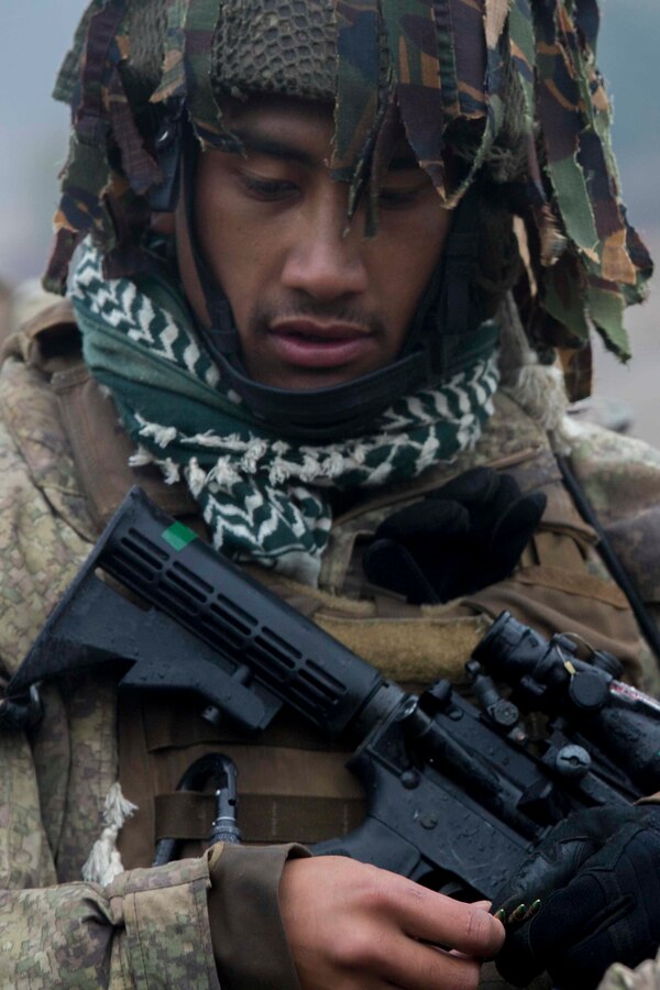 A New Zealand Army soldier with 161st Battery, 16th Field Regiment, loads a magazine during marksmanship training in support of Ssang Yong 2016, on Suseong Ri Firing Range, South Korea, March 4, 2016. Exercise Ssang Yong 2016 is a biennial military exercise focused on strengthening the amphibious landing capabilities of the Republic of Korea, the U.S., New Zealand and Australia. (U.S. Marine Corps Photo by Lance Cpl. Juan C. Bustos/ Released)