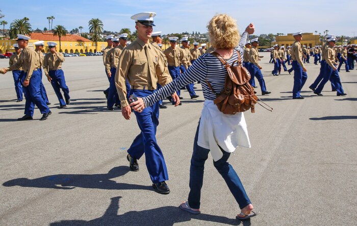 A Marine from Echo Company, 2nd Recruit Training Battalion, greets his loved one after graduating from recruit training at Marine Corps Recruit Depot San Diego, March 4. After graduation, all Marines are given 10 days of leave before taking the next step in training. Annually, more than 17,000 males recruited from the Western Recruiting Region are trained at MCRD San Diego.