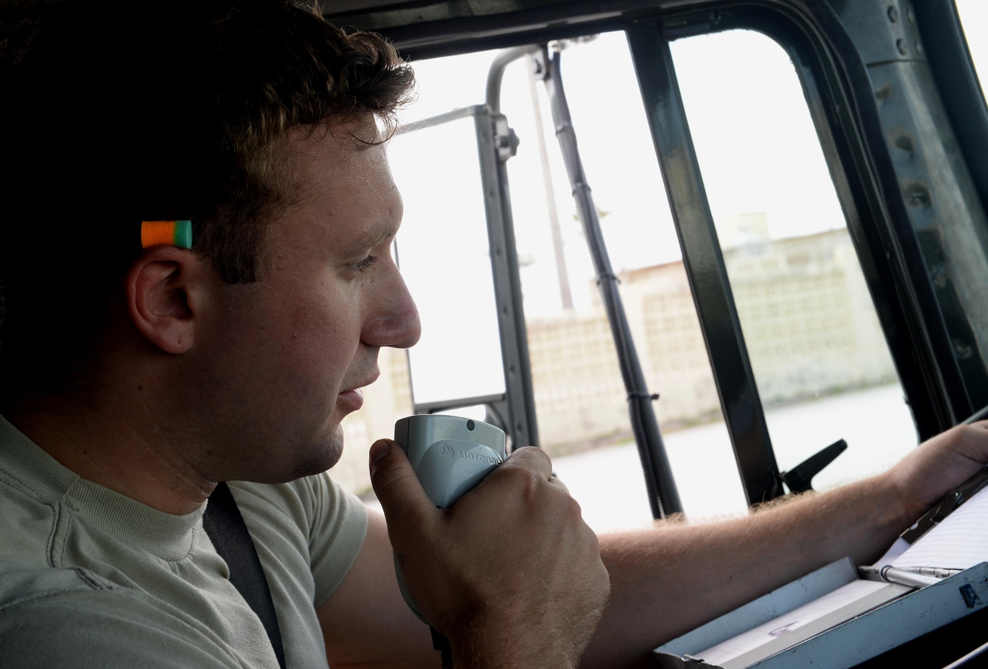 Airman 1st Class Nicholas Blanchette, 36th Logistics Readiness Squadron Fuels Management Flight mobile distributor, receives a refuel request via radio Feb. 26, 2016, at Andersen Air Force Base, Guam. Fuels management technicians  service all aircraft, machinery and vehicles on Andersen AFB with the fuel needed to ensure the mission never stops. (U.S. Air Force photo/Airman 1st Class Alexa Ann Henderson)
