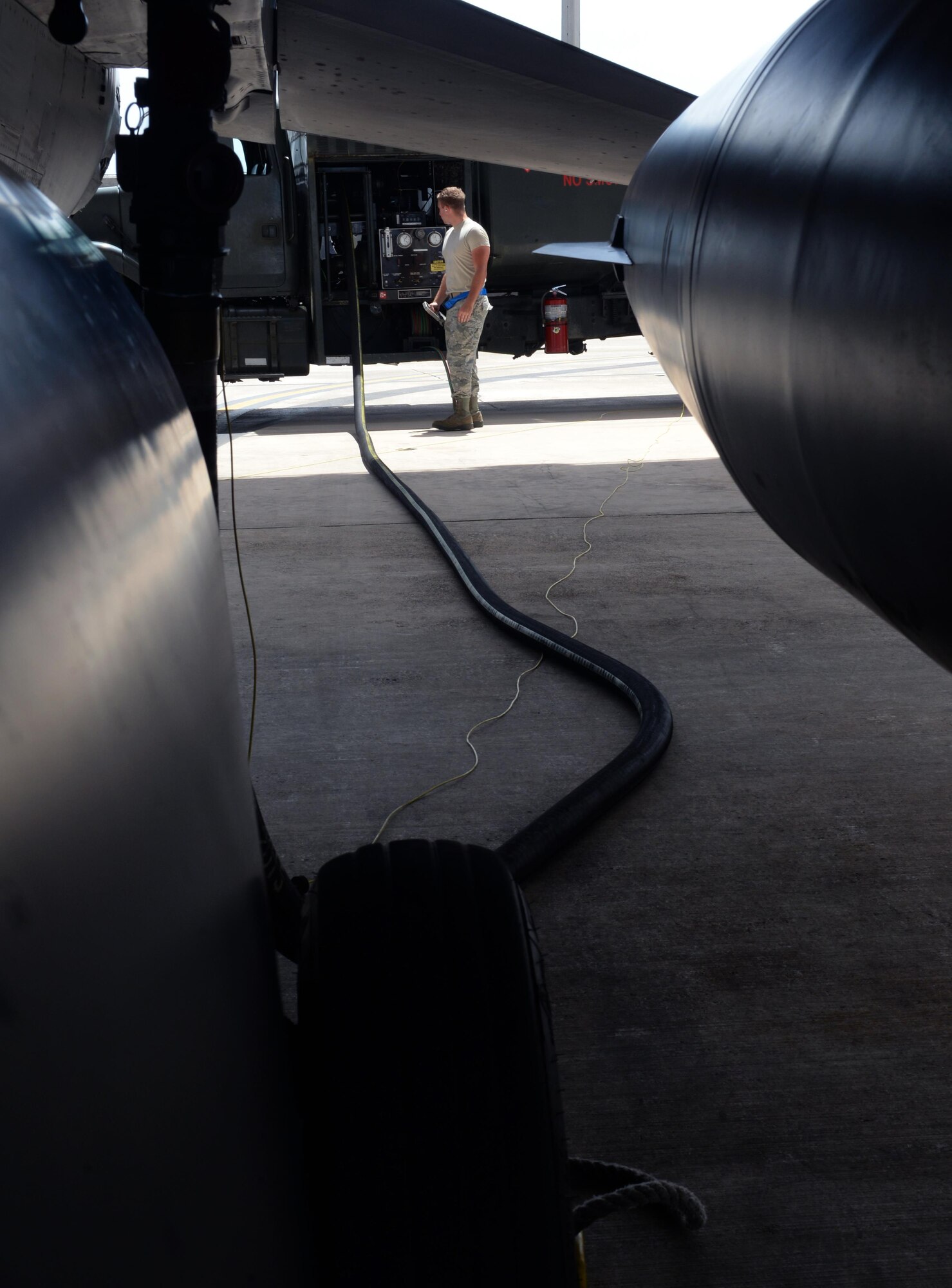 Airman 1st Class Nicholas Blanchette, 36th Logistics Readiness Squadron Fuels Management Flight mobile distributor, refuels a U.S. Air Force F-16 Fighting Falcon Feb. 26, 2016, at Andersen Air Force Base, Guam. Blanchette filled out receipts noting the amount of fuel that was distributed to the aircraft to document the transaction for the aircrew. (U.S. Air Force photo/Airman 1st Class Alexa Ann Henderson)