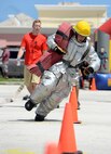 Airman 1st Class Jared May, 36th Civil Engineer Squadron fire protection crew chief, navigates through an obstacle during the annual Guam Fire Muster competition March 5, 2016, in Hagåtña, Guam. The competition simulated obstacles and challenges firefighters could face when responding to an emergency. (U.S. Air Force photo/Staff Sgt. Benjamin Gonsier)