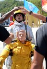 Airman 1st Class Jared May, 36th Civil Engineer Squadron fire protection crew chief, carries a dummy during the annual Guam Fire Muster competition March 5, 2016, in Hagåtña, Guam. The fire muster tests a firefighter’s ability to perform basic firefighting techniques to include spraying a target with water, navigating through obstacles, carrying a casualty and using a sledgehammer. (U.S. Air Force photo/Staff Sgt. Benjamin Gonsier)