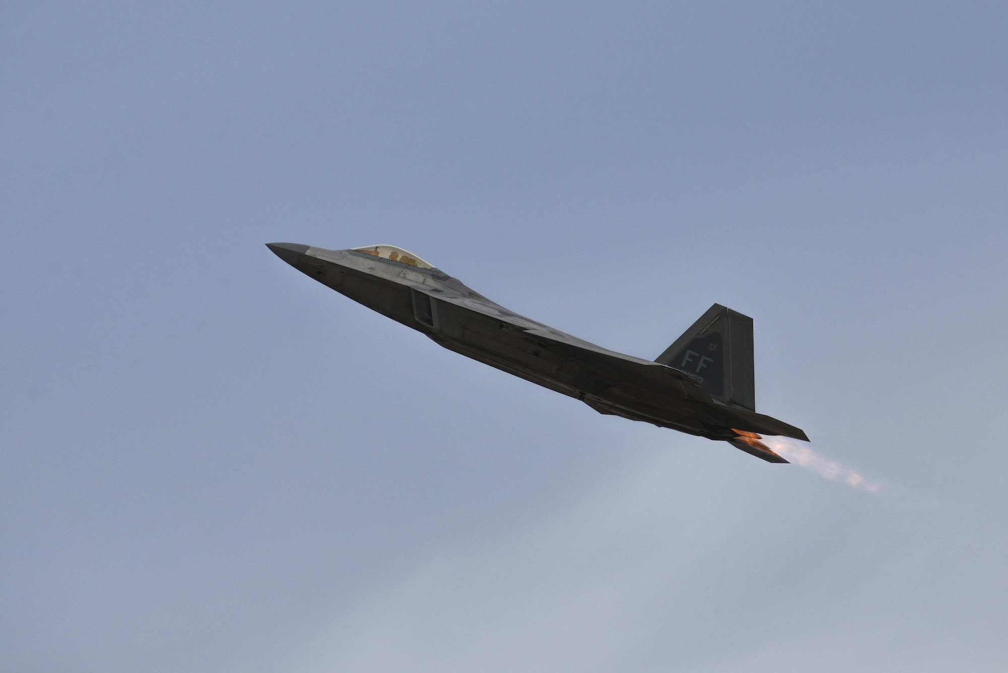 A U.S. Air Force F-22 Raptor performs an aerial manuever during the 2016 Heritage Flight Training and Certification Course at Davis-Mothan Air Force Base, Ariz., March 5, 2016. The Raptor’s combination of stealth, supercruise, maneuverability, and integrated avionics, coupled with improved supportability, represents an exponential leap in warfighting capabilities. (U.S. Air Force photo by Senior Airman Chris Massey/Released)