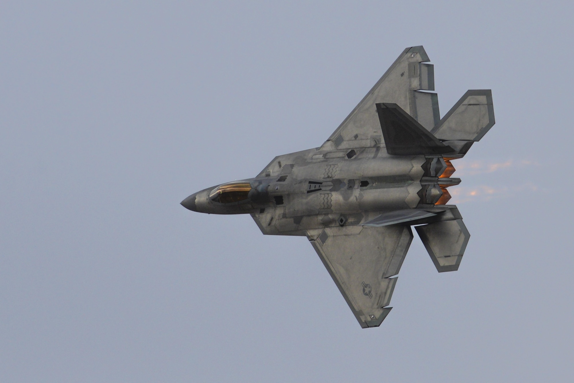 A U.S. Air Force F-22 Raptor performs an aerial maneuver during the 2016 Heritage Flight Training and Certification Course at Davis-Mothan Air Force Base, Ariz., March 5, 2016.  The annual aerial demonstration training event has been held at D-M since 2001, and the course featured aerial demonstrations from historical and modern fighter aircraft. (U.S. Air Force photo by Senior Airman Chris Massey/Released)