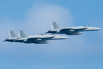 160307-N-GZ947-112 PHILIPPINE SEA (March 7, 2016) - Three F/A-18E Super Hornets assigned to the Warhawks of Strike Fighter Squadron (VFA) 97 fly in formation for an aerial change of command ceremony as Cmdr. Douglas Peterson is relieved by Cmdr. Matthew Doyle. Providing a ready force supporting security and stability in the Indo-Asia-Pacific, Stennis is operating as part of the Great Green Fleet on a regularly scheduled 7th Fleet deployment. (U.S. Navy photo by Mass Communication Specialist 3rd Class Kenneth Rodriguez Santiago / Released)