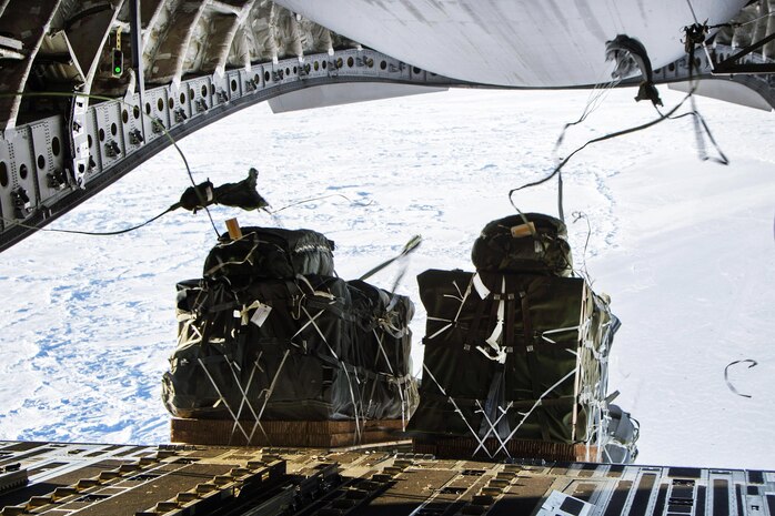160302-F-XA488-149A ARCTIC OCEAN (Mar. 2, 2016) Airmen participate in an air drop of more than 12,000 pounds of cargo out the back of a C-17 Globemaster III aircraft in support of the U.S. Navy submarine forces Ice Exercise 2016 over the Arctic Ocean, March 2, 2016. The drop was made from 550 feet above ground level. (U.S. Air Force photo by Staff Sgt. Sheila DeVera/Released)