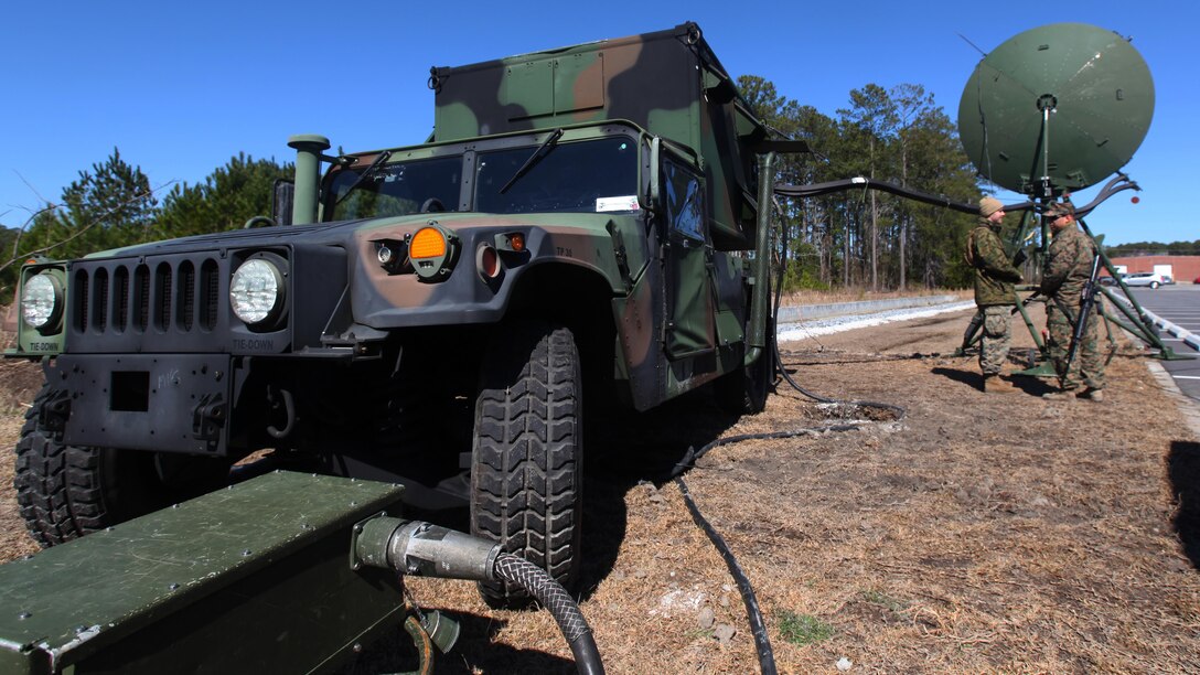 Marines with Company B, Marine Wing Communications Squadron 28 inspect an AN/TRC-170 during a communications field exercise at Marine Corps Air Station Cherry Point, N.C., March 3, 2016. The MWCS-28 incorporates numerous systems ranging from single-channel radios to systems with an emphasis on interoperability and beyond line-of-sight communications for a broad spectrum of information services. During the exercise, Bravo Company provided their own Tactical Air Operations Center, Tactical Air Command Center and simulated unmanned aerial vehicle squadron requests, giving the Marines a broader understanding on what roles requesting agencies play during operations within a communications squadron.