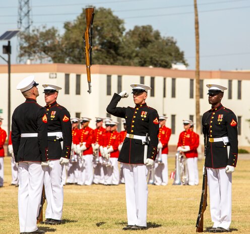 The United States Marine Corps Silent Drill Platoon holds a performance for station military personnel and families at Marine Corps Air Station Yuma, Ariz., March 3, 2016. Based out of the “Oldest Post of the Corps,” Marine Barracks 8th & I, Washington D.C., the revered platoon settles into Yuma every year for spring training, as they prepare for their tour of the West Coast. (U.S. Marine Corps photo by Lance Cpl. Brendan King/ Released)