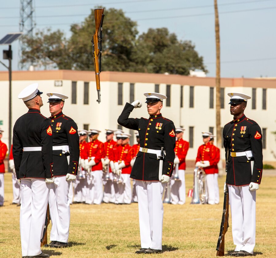 The United States Marine Corps Silent Drill Platoon holds a performance for station military personnel and families at Marine Corps Air Station Yuma, Ariz., March 3, 2016. Based out of the “Oldest Post of the Corps,” Marine Barracks 8th & I, Washington D.C., the revered platoon settles into Yuma every year for spring training, as they prepare for their tour of the West Coast. (U.S. Marine Corps photo by Lance Cpl. Brendan King/ Released)