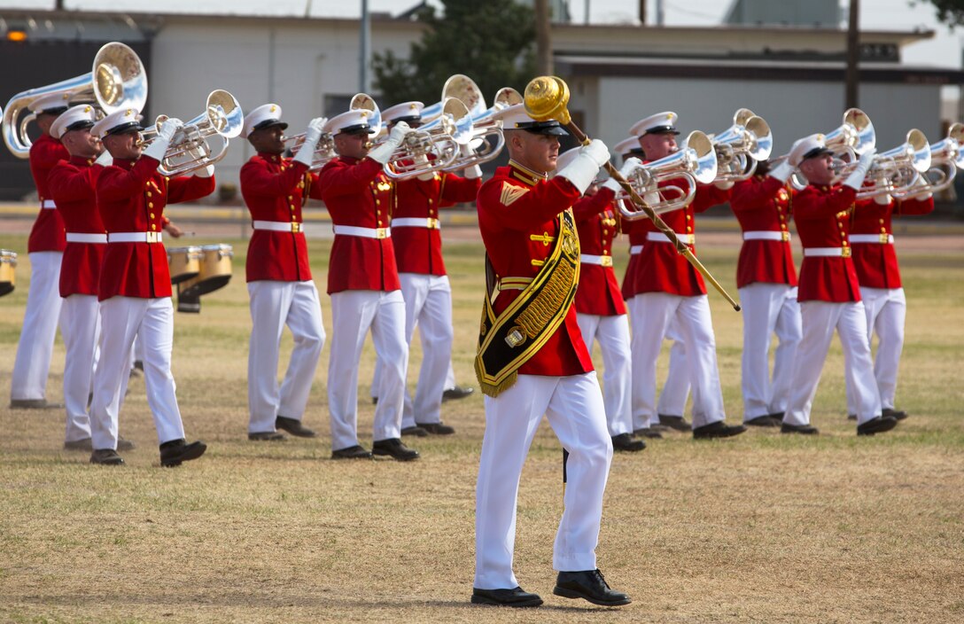 The United States Marine Drum & Bugle Corps holds a performance in front of station military personnel and their families at Marine Corps Air Station Yuma, Ariz., March 3, 2016. Known as “The Commandant’s Own,” and based out of Marine Barracks Washington D.C., the band comes to Yuma every year for a short time during their spring training, in preparation of their West Coast tour performances. (U.S. Marine Corps photo by Lance Cpl. Brendan King/ Released)