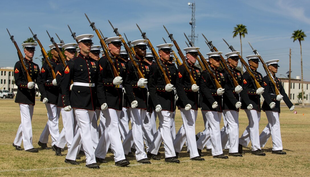 The United States Marine Corps Silent Drill Platoon holds a performance for station military personnel and families at Marine Corps Air Station Yuma, Ariz., March 3, 2016. Based out of the “Oldest Post of the Corps,” Marine Barracks 8th & I, Washington D.C., the revered platoon settles into Yuma every year for spring training, as they prepare for their tour of the West Coast. (U.S. Marine Corps photo by Lance Cpl. Brendan King/ Released)