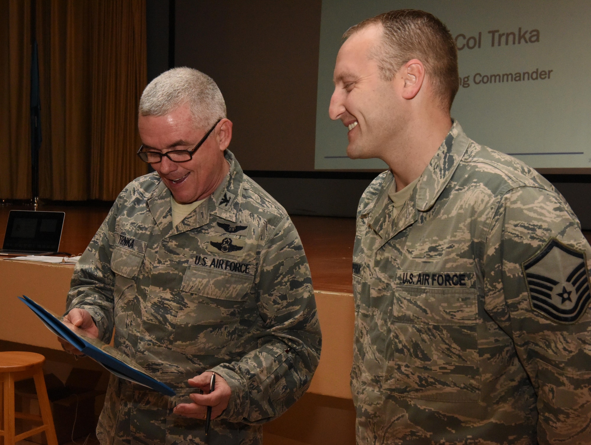 Master Sgt. Daniel Nichiporuk, 940th Wing In-Service Recruiter, accepts a certificate from 940th Wing commander, Col. John Trnka Jr. during a commander’s all call at Beale Air Force Base, California March 5, 2016. The certificate, awarded to him by the Community College of the Air Force, recognizes him as a professional manager. 