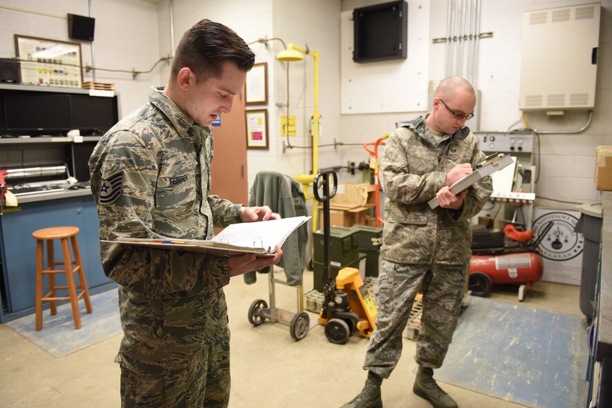 Tech. Sgt.William Fedorek, munitions inspector of the munitions flight with the 911th Maintenance Squadron, gives a safety briefing under the supervision of Staff Sgt. Matthew Hohe, quality assurance inspector of the munitions flight, at the Pittsburgh International Air Reserve Station, March 3, 2016.  Fedorek is being evaluated on his ability to give a safety briefing, a task that must be performed to ensure the safety of airmen working with and around munitions. (U.S. Air Force photo by Airman Bethany Feenstra)