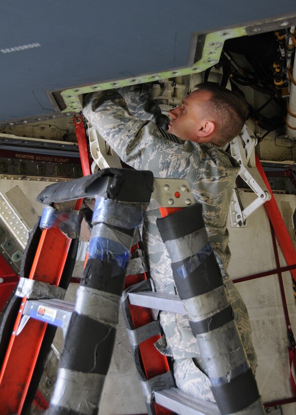 131st Bomb Wing’s Tech. Sgt. Andy Hicks works on a B-2 Spirit Stealth aircraft at Whiteman Air Force Base, Missouri. Hicks’ work ethic and dedication have not only earned him praise in his Missouri Air National Guard career, but also as Missouri’s top emergency medical technician for 2015. (U.S. Air National Guard photo by Senior Airman Nathan Dampf)