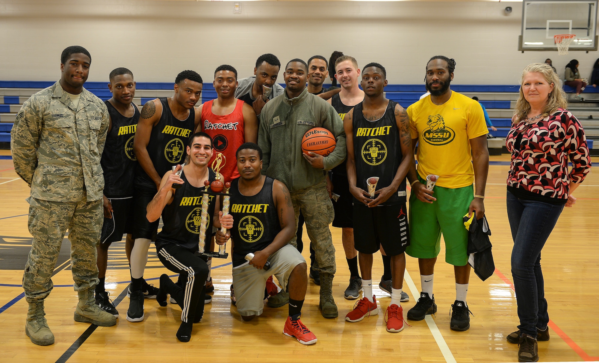 The 22nd Maintenance Operations, “Team Ratchet” intramural basketball team pose with the 2015-2016 intramural basketball championship trophy, Feb. 25, 2016, at McConnell Air Force Base, Kan. Team Ratchet won the champion with a 37-35 victory over the 22nd Aircraft Maintenance Squadron basketball team. (U.S. Air Force photo/Senior Airman Colby L. Hardin)