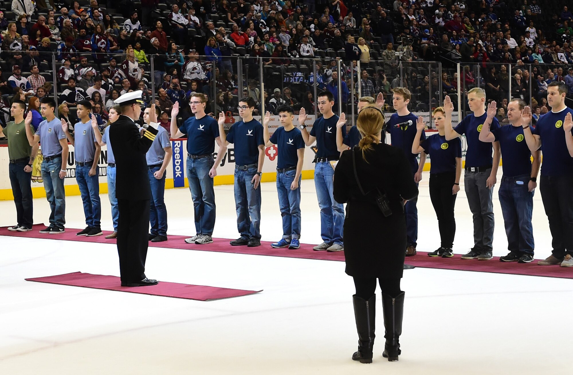 Prospective military members swore in during intermission at the Colorado Avalanche hockey game March 5, 2016, at the Pepsi Center in Denver, Colo. The recruits took the ice during intermission to be sworn into the United States military during the Avalanche “Military Appreciation Day.” (U.S. Air Force photo by Airman 1st Class Luke W. Nowakowski/Released)