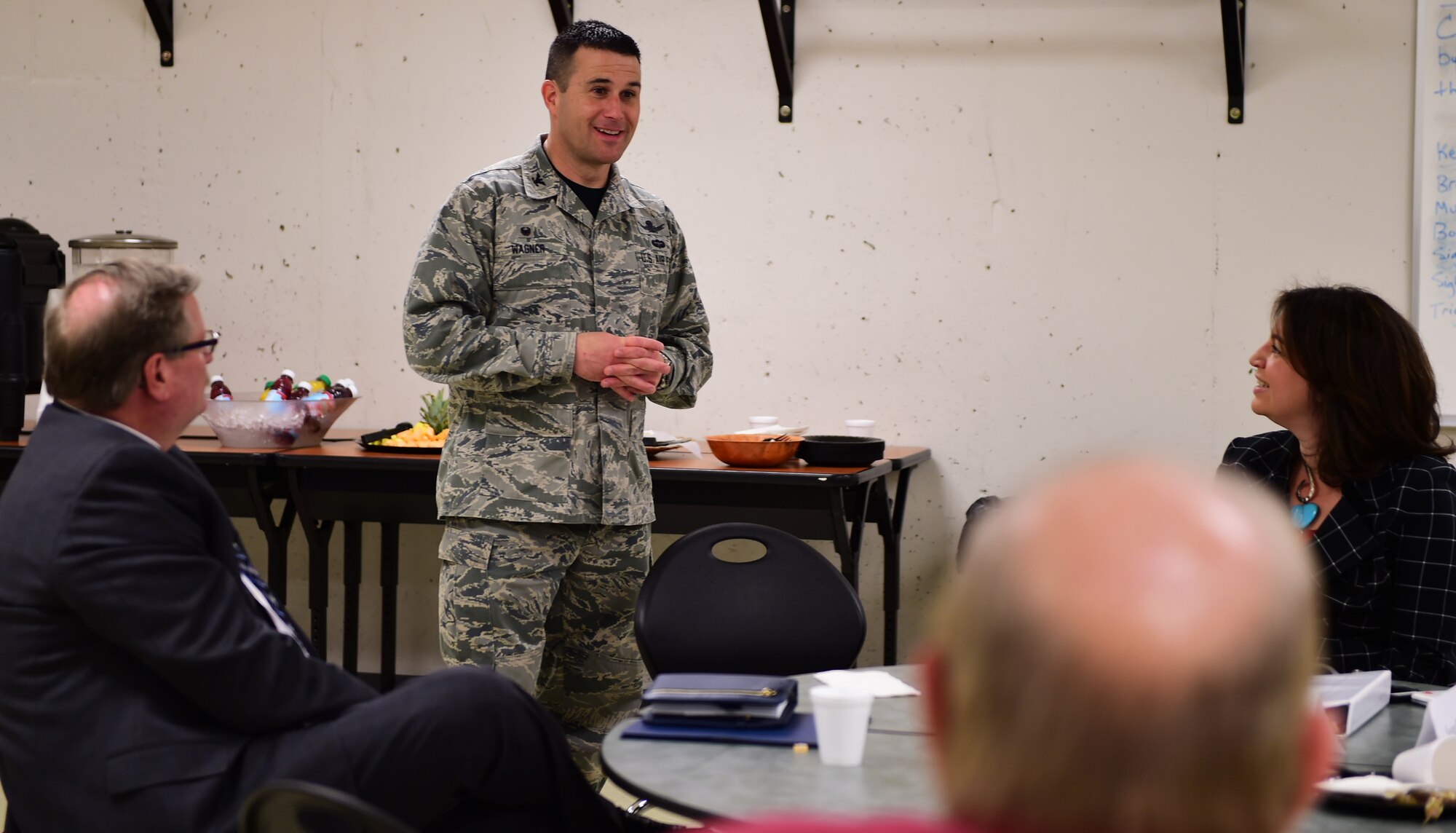 Col. John Wagner, 460th Space Wing commander, greets the Commerce City Leadership Program attendees March 4, 2016, at Adams City High School in Commerce City, Colo. Wagner began by highlighting the relationship between the local defense community and Buckley Air Force Base, and spoke about Building a Better Buckley together. (U.S. Air Force photo by Senior Airman Racheal E. Watson/Released)