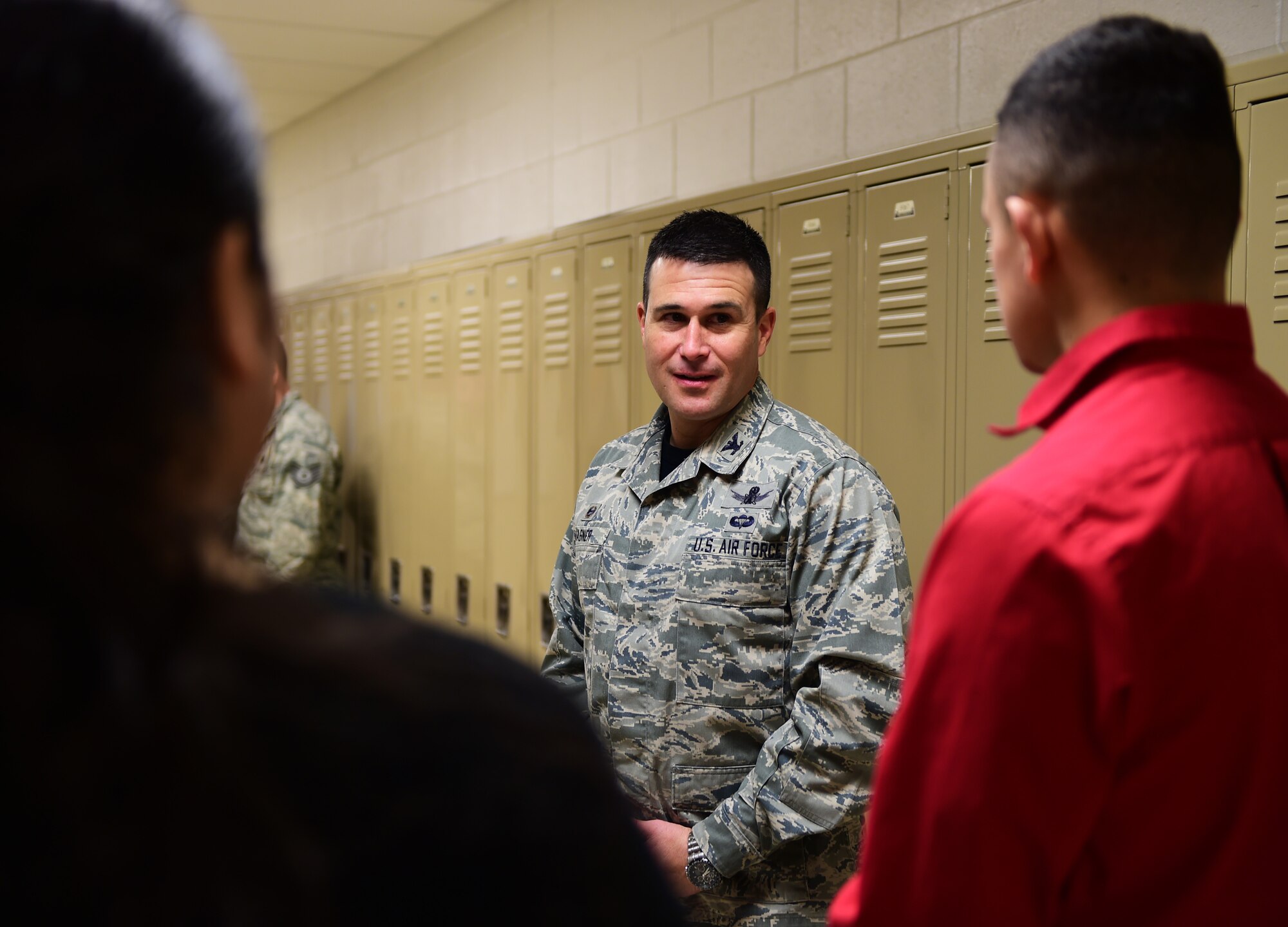 Col. John Wagner, 460th Space Wing commander, speaks with Marine Corps Junior Reserve Officers’ Training Corps cadets March 4, 2016, at Adams City High School in Commerce City, Colo. Wagner connected with future leaders by discussing plans after high school, current activities and programs they are involved in. (U.S. Air Force photo by Senior Airman Racheal E. Watson/Released)