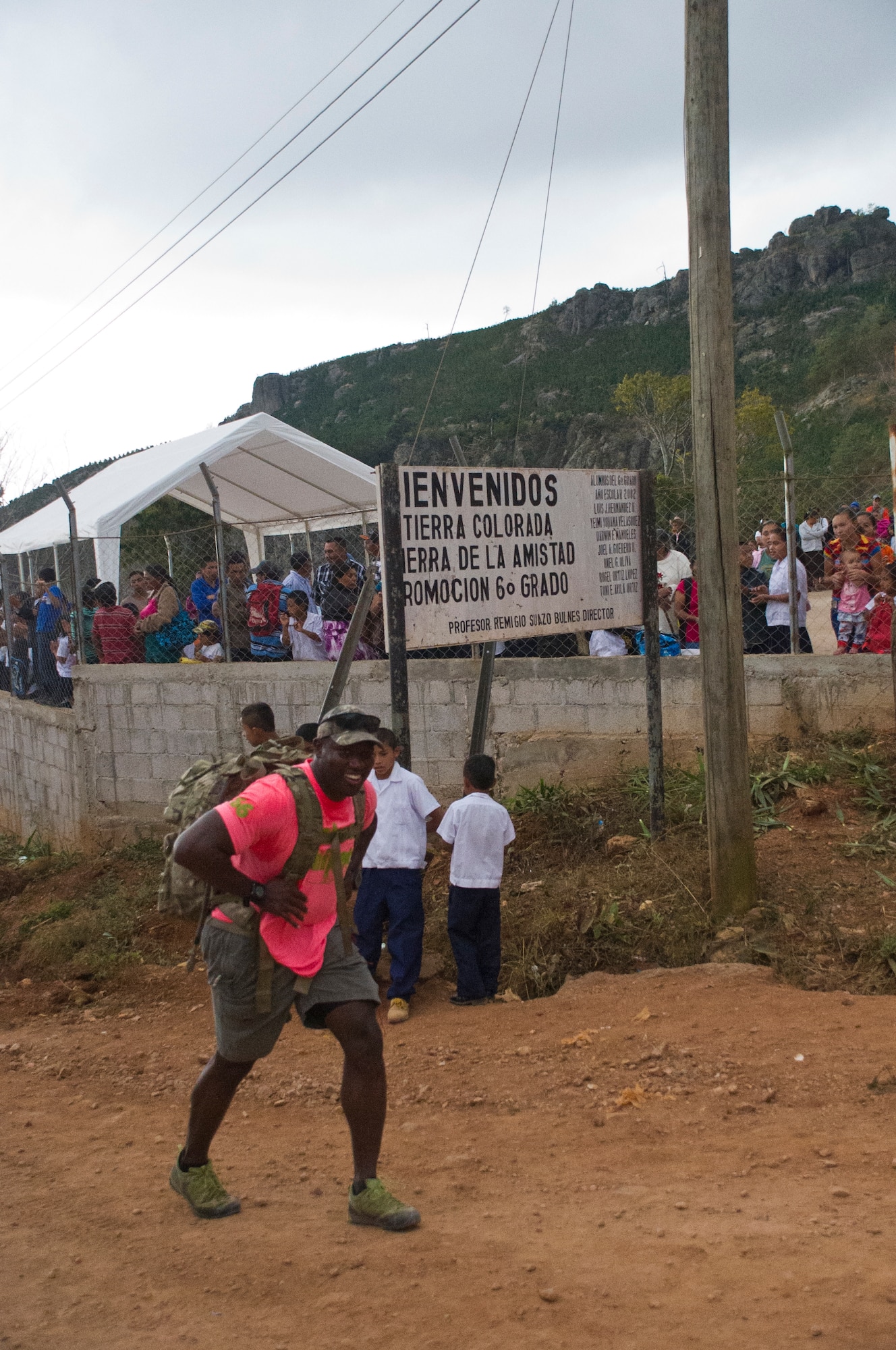 Staff Sgt. Ricardo Augustin, Joint Task Force- Bravo Operations, finishes the hiking portion of Chapel Hike 66 March 5, 2016, at Tierra Colorada, Honduras, before handing the dry goods on his back off to a family in need of food. The Chapel Hike program, established in 2007, is a means for JTF-Bravo members to provide their time to the communities around Soto Cano Air Base, Honduras. (U.S. Air Force photo by Capt. Christopher Mesnard)