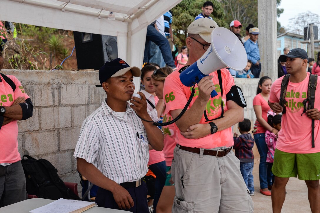 Wilmer Alexander Vásquez, Tierra Colorada community leader helps organize residents from various villages in La Paz Department, Honduras, March 5, 2016, during a volunteer Chapel Hike. The hikes are a means for members of Joint Task Force-Bravo to provide food to villages in various communities near Soto Cano Air Base and develop a greater understanding and appreciation for those who live there. (U.S. Air Force photo by Staff Sgt. Westin Warburton/Released)