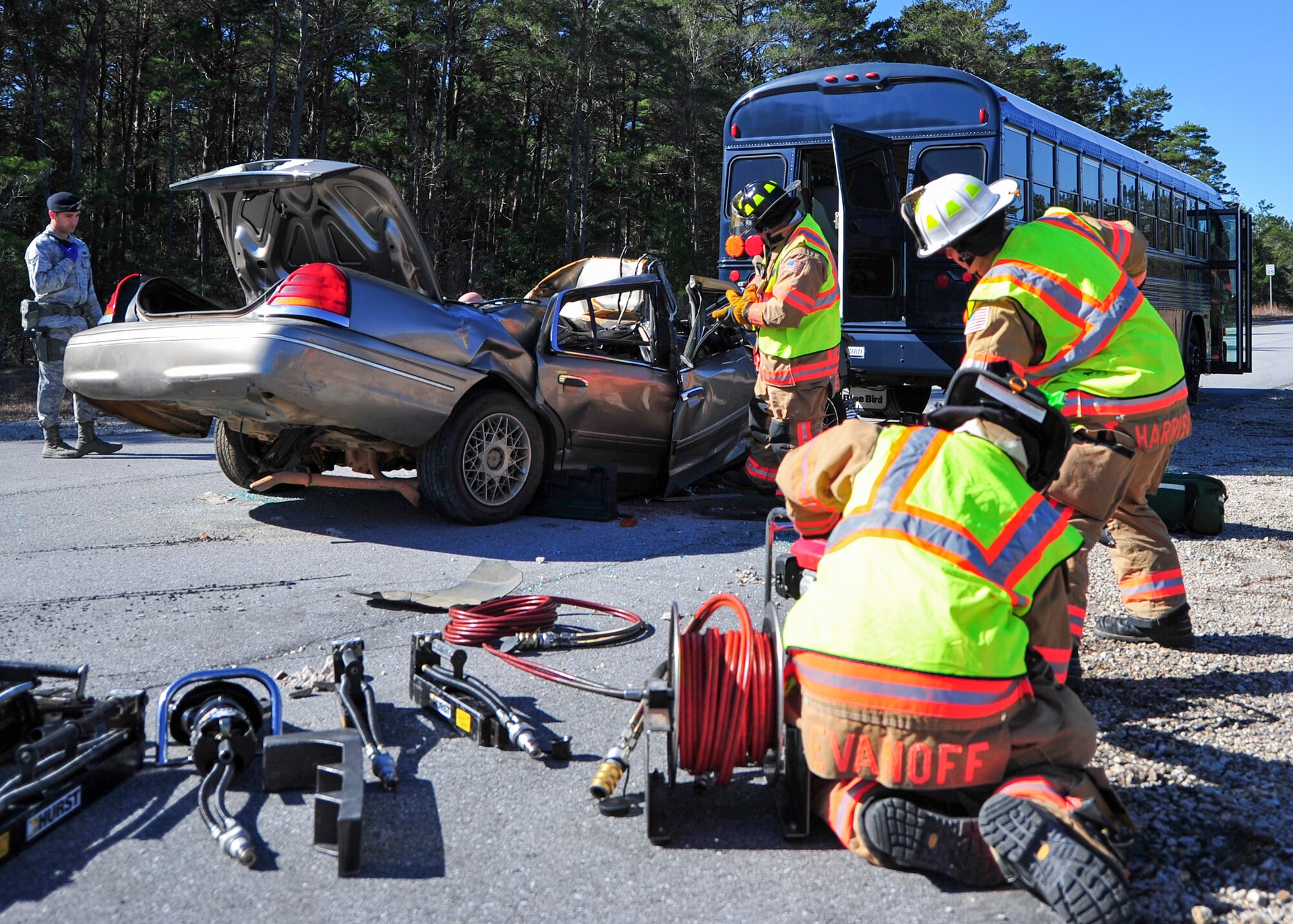 Base first responders begin rescue operations during a mass casualty exercise Feb. 25 at Eglin Air Force Base, Fla. Base medical emergency personnel, firefighters and defenders practiced rescue and safety skills during the simulated two-vehicle accident that caused 19 injuries and one death. (U.S. Air Force photo/Ilka Cole)
