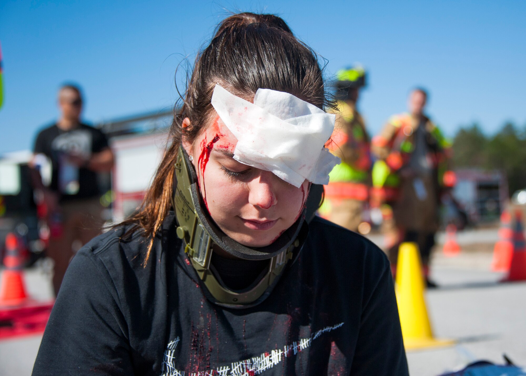 An exercise participant acts as an accident victim during a mass casualty exercise Feb. 25 at Eglin Air Force Base, Fla. Base medical emergency personnel, firefighters and defenders practiced rescue and safety skills during the simulated two-vehicle accident that caused 19 injuries and one death. (U.S. Air Force photo/Ilka Cole)