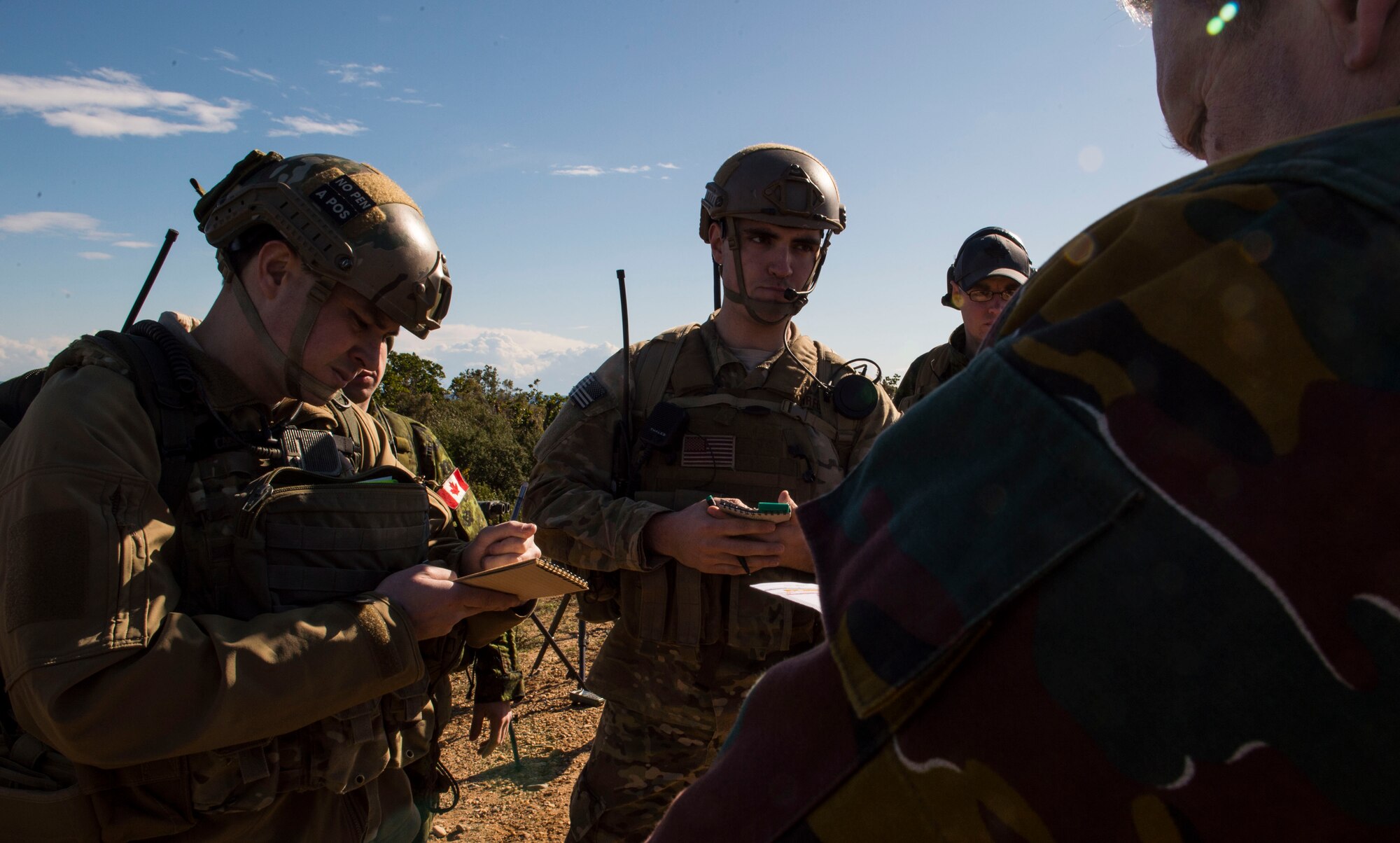 Tech. Sgt. Jeremy Rarang and Senior Airman Gage Duvall, 2nd Air Support Operations Squadron joint terminal attack controllers, interact with Belgian JTACs during exercise SERPENTEX 16, March 7, 2016. Approximately 215 Airmen, including JTACs from the 2nd Air Support Operations Squadron, from Vilseck, Germany, are participating in the annual exercise held at NATO’s tactical training center and the French Air Force’s Air Base 126 Solenzara, France. (U.S. Air Force/Staff Sgt. Sara Keller)