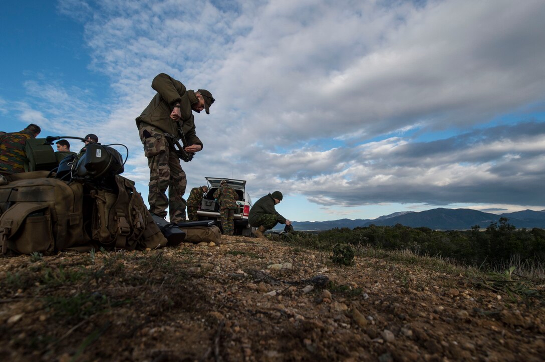 Canadian and French joint terminal attack controllers prepare their equipment for the first day of training during exercise SERPENTEX 16, March 7, 2016. Training and theater security cooperation engagements with U.S. allies and partners, such as Exercise SERPENTEX, demonstrate a shared commitment to promoting security and stability. (U.S. Air Force/Staff Sgt. Sara Keller)