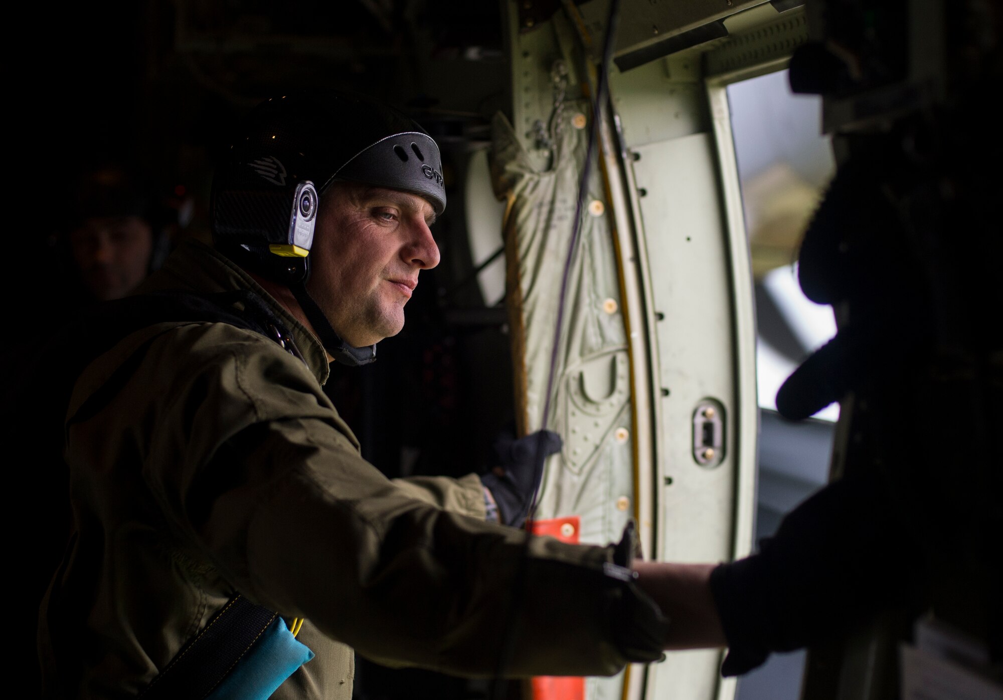 A Portuguese jumpmaster looks out of a C-130J Super Hercules assigned to the 37th Airlift Squadron during exercise Real Thaw 16 in Beja, Portugal, Feb. 25, 2016. Approximately 50 paratroopers were airdropped by the 37th AS during the event. (U.S. Air Force photo/Senior Airman Jonathan Stefanko)