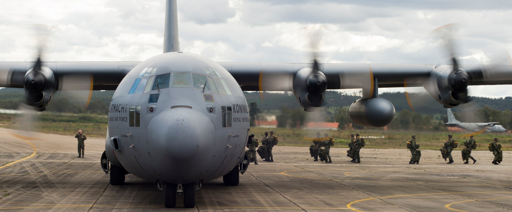Portuguese paratroopers load onto a Royal Netherlands air force C-130H Hercules during exercise Real Thaw 16 in Beja, Portugal, Feb. 25, 2016. Royal Netherlands air force worked alongside the U.S. to airdrop more than 100 paratroopers. (U.S. Air Force photo/Senior Airman Jonathan Stefanko)