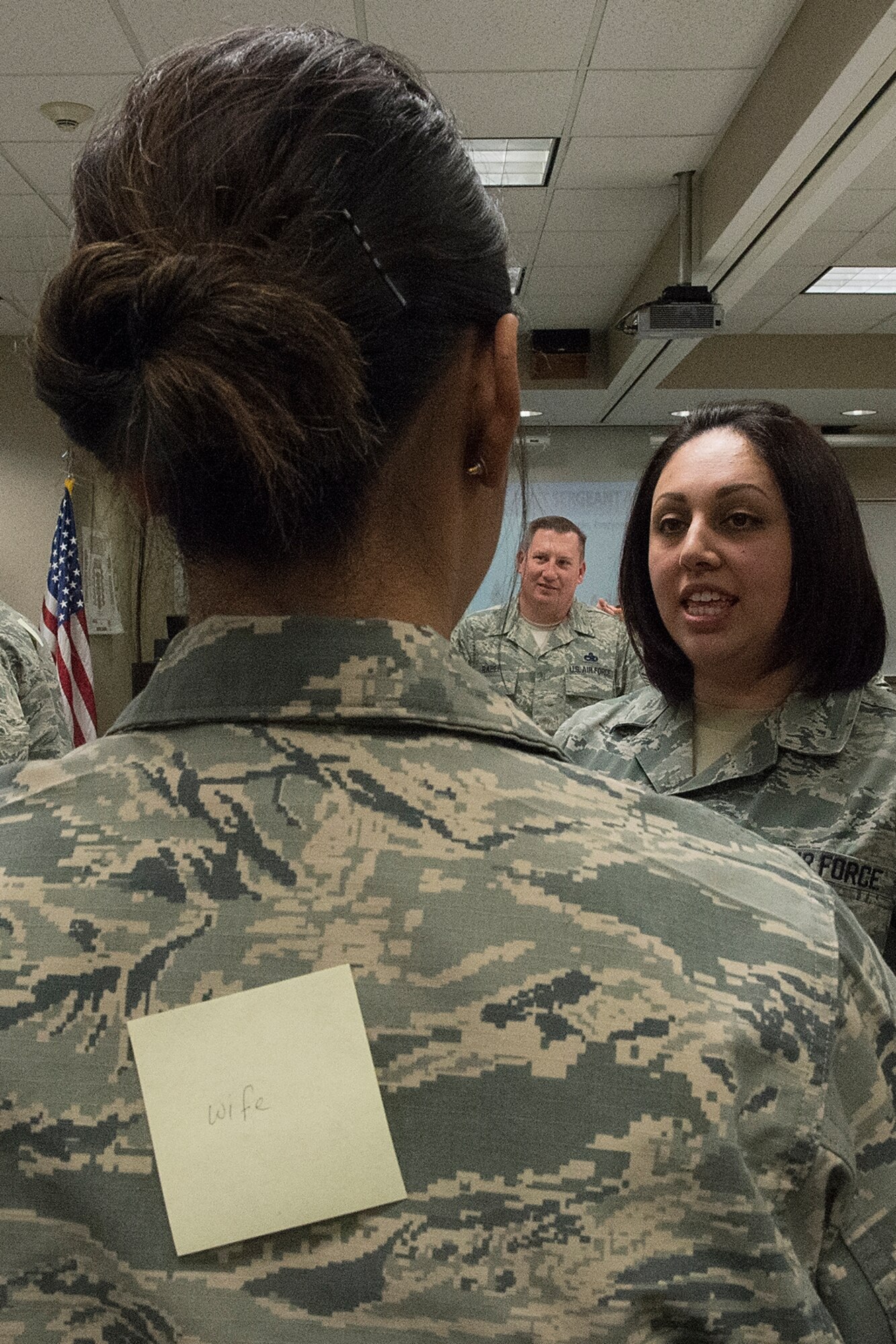 Master Sgt. Angie Hall, 434th Logistics Readiness Squadron material management craftsman, talks to a classmate during an exercise designed to get participants to talk and communicate with each other March 3, 2016 at Grissom Air Reserve Base, Indiana. The symposium was held to help additional duty first sergeants better understand their roles and provide them with the tools they need effectively fill the role first sergeant. (U.S. Air Force photo/Douglas Hays)