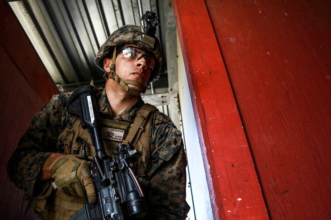 Marine Corps Lance Cpl. Roger Freckleton gets into position as the point man for his team during combat marksmanship training on Camp Pendleton, Calif., March 2, 2016. The training was part of a course to enhance small-unit leadership in an urban setting. Freckleton is a scout rifleman assigned to the 1st Marine Division's1st Light Armored Reconnaissance Battalion. Marine Corps photo by Sgt. Emmanuel Ramos
