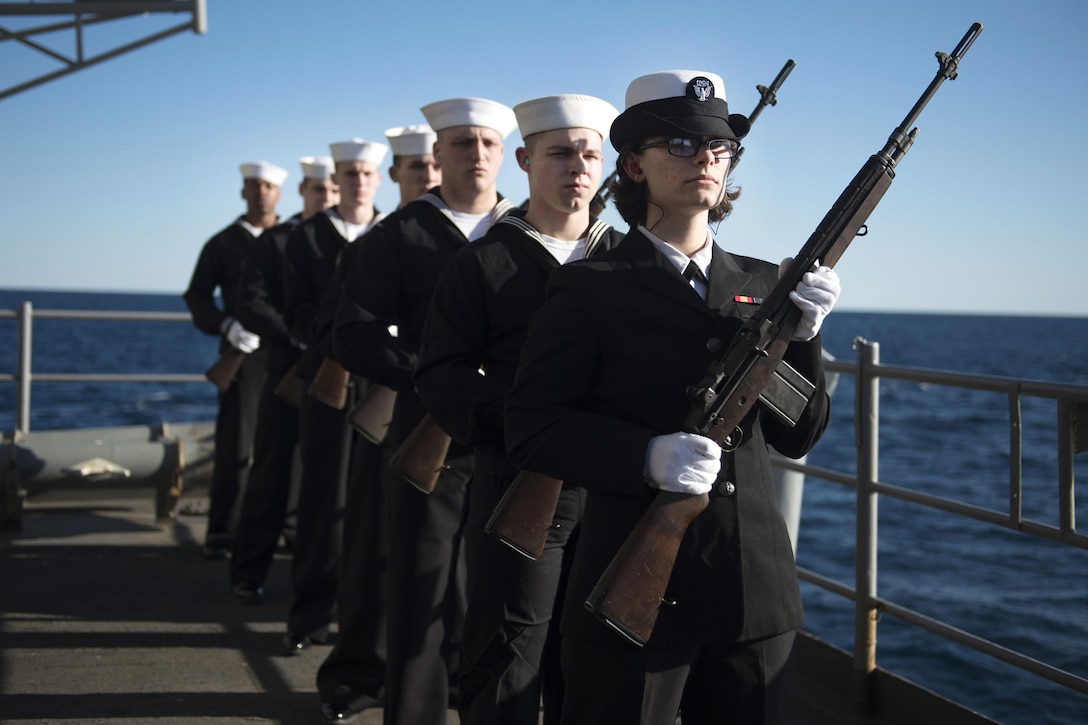 A ceremonial rifle team prepares to fire a 21-gun salute during a burial at sea from aboard the aircraft carrier USS Dwight D. Eisenhower in the Atlantic Ocean, March 1, 2016. Navy photo by Petty Officer 3rd Class J. E. Veal