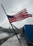 160307-N-OI810-232 YOKOSUKA, Japan (March 7, 2016) The Ensign is flown at half-mast aboard the U.S. Navy's only forward-deployed aircraft carrier USS Ronald Reagan (CVN 76) in remembrance of former first lady Nancy Reagan. Mrs. Reagan served as the ship's sponsor since its commissioning in 2003. (U.S. Navy photo by Mass Communication Specialist 3rd Class Nathan Burke/Released)