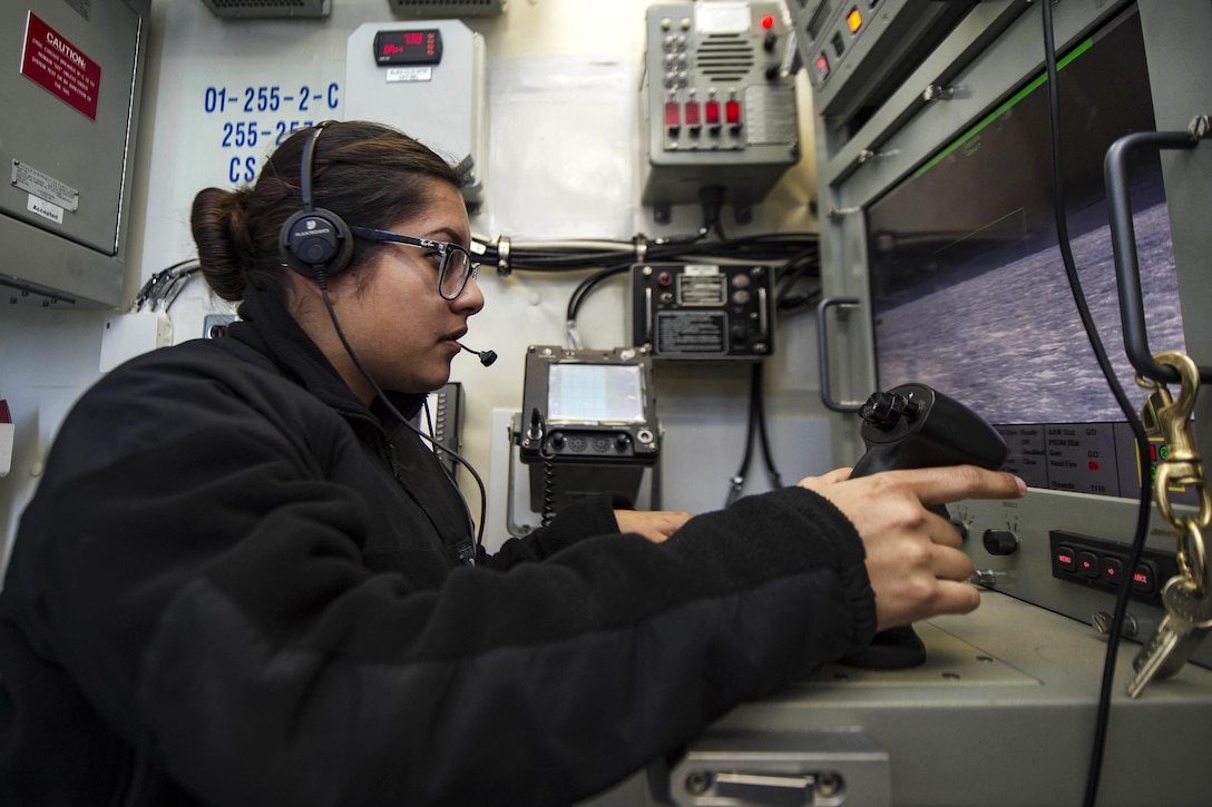Navy Petty Officer 3rd Class Samantha Orta observes the Phalanx close-in weapon system monitor aboard the aircraft carrier USS Dwight D. Eisenhower in the Atlantic Ocean, March 3, 2016. Orta is a fire controlman. Navy photo by Petty Officer 3rd Class Anderson W. Branch