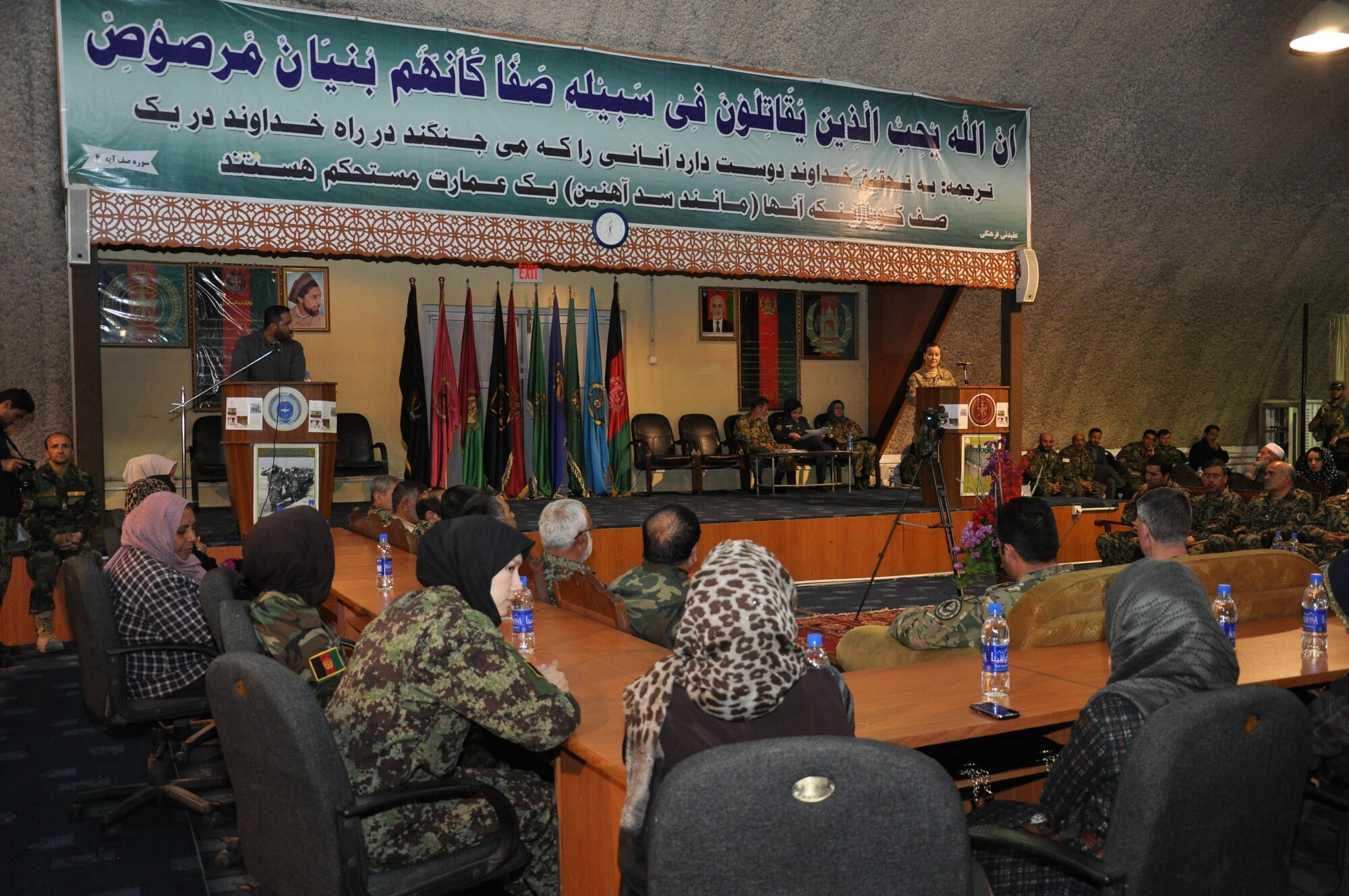 Capt. Carri Salas from Train, Advise, Assist Command-Air (TAAC-Air) speaks to guests at the Afghan air force’s International Women’s Day conference March 6, 2016, at Kabul Air Wing, Kabul, Afghanistan. Approximately 200 AAF and TAAC-Air military men and women attended the event to include guest speakers from the AAF commander to women educators and officers. (U.S. Air Force photo by Capt. Eydie Sakura/released)