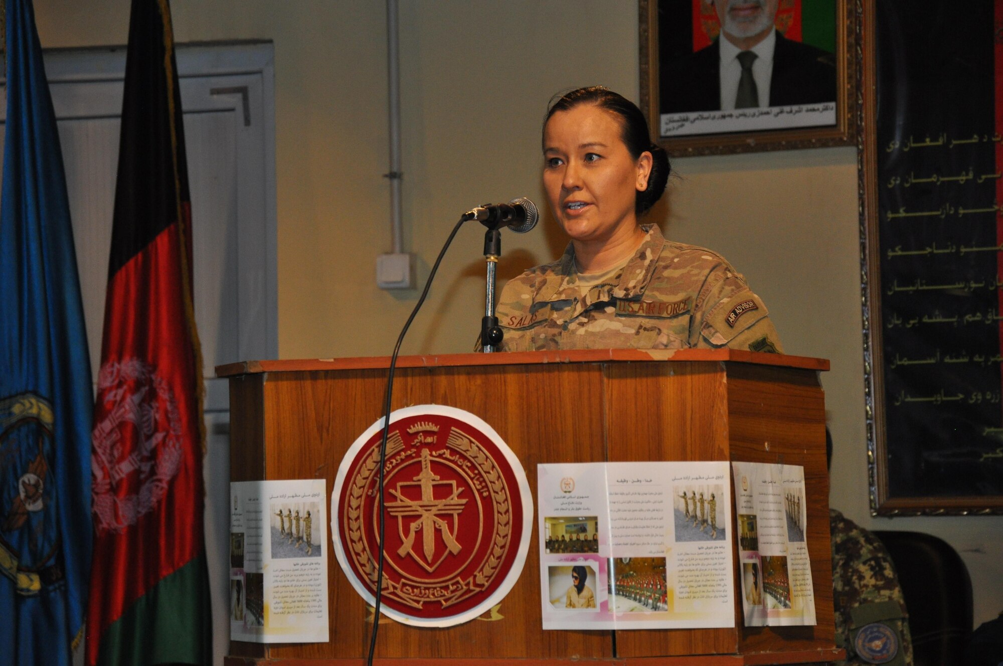 Capt. Carri Salas from Train, Advise, Assist Command-Air (TAAC-Air) speaks to guests at the Afghan air force’s International Women’s Day conference March 6, 2016, at Kabul Air Wing, Kabul, Afghanistan. Approximately 200 AAF and TAAC-Air military men and women attended the event to include guest speakers from the AAF commander to women educators and officers. (U.S. Air Force photo by Capt. Eydie Sakura/released)